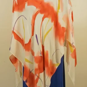 Mannequin wearing artistic poncho top